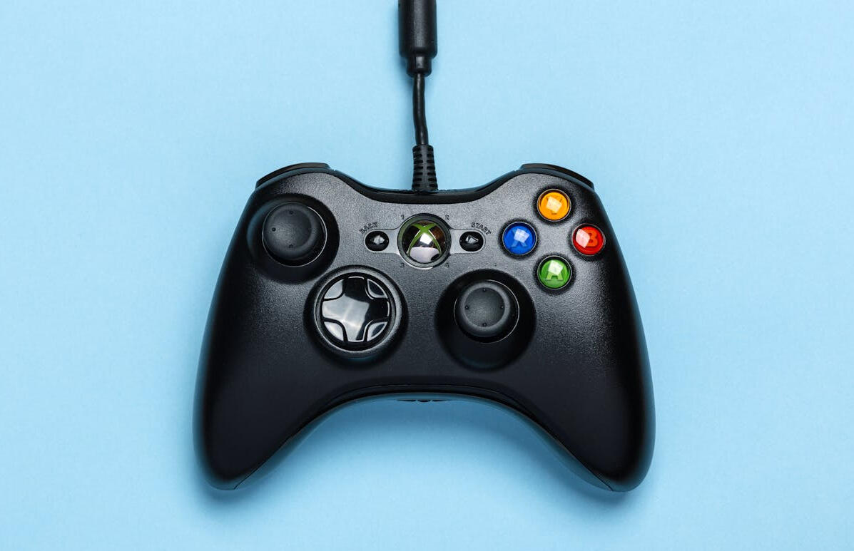 Writing for games/apps A black gaming controller on a light blue background